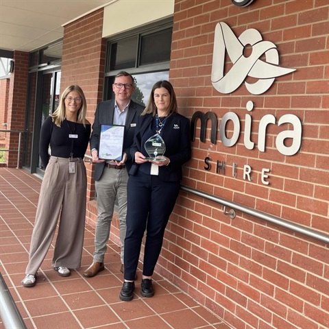 Abbey Monk from GMLLEN (left) presents the Supporting Young People 2025 award to Moira Shire Council CEO Matthew Morgan and People and Culture officer Crystal Gemmill..jpg
